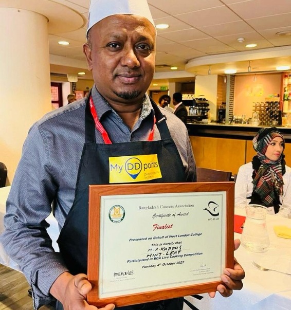chef-holding-award-certificate.jpeg